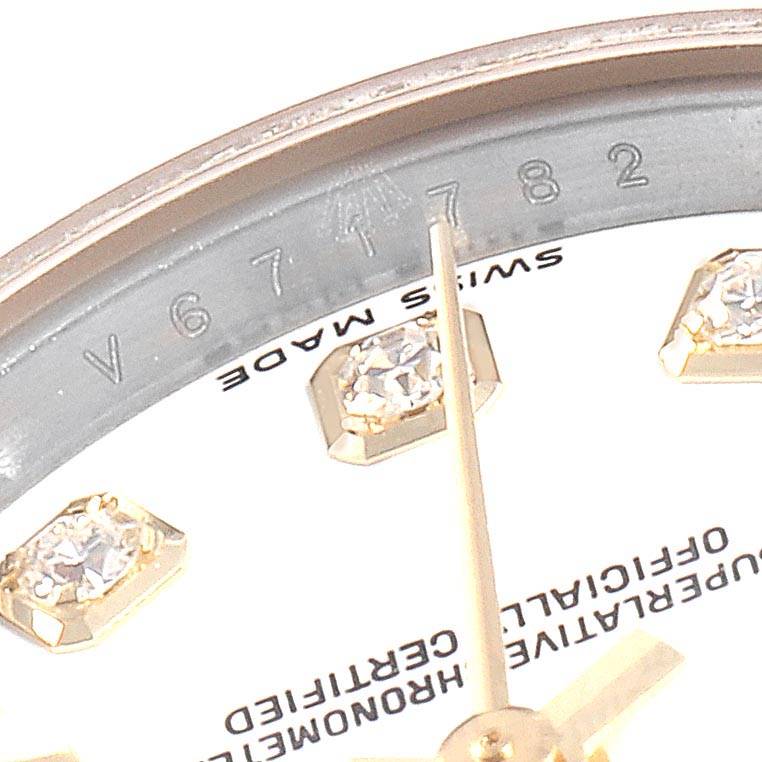 This is a close-up shot showing the dial with diamond indices and part of the bezel of the Rolex Datejust 179173 Women's Steel and Gold (two tone) White Dial 179173 Women's Steel and Gold (two tone) White Dial watch.