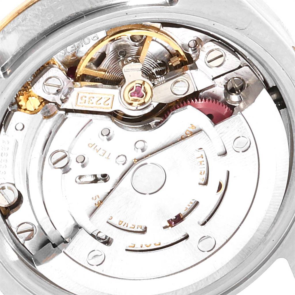 The image shows a close-up of the movement mechanism of a Rolex Datejust 179173 Women's Steel and Gold (two tone) White Dial 179173 Women's Steel and Gold (two tone) White Dial watch.