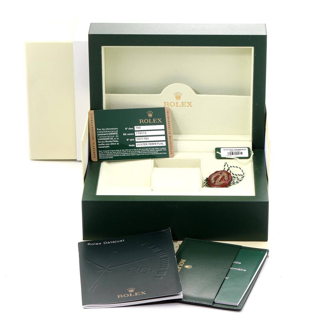 This image shows the Rolex Datejust 179173 Women's Steel and Gold (two tone) White Dial 179173 Women's Steel and Gold (two tone) White Dial watch box, warranty card, booklets, and tags from a front angle.