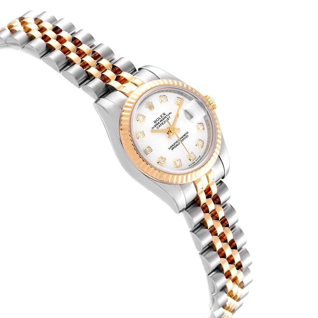 This image shows a Rolex Datejust 179173 Women's Steel and Gold (two tone) White Dial 179173 Women's Steel and Gold (two tone) White Dial watch from an angled top view, highlighting its gold and silver bracelet, fluted bezel, and white dial.