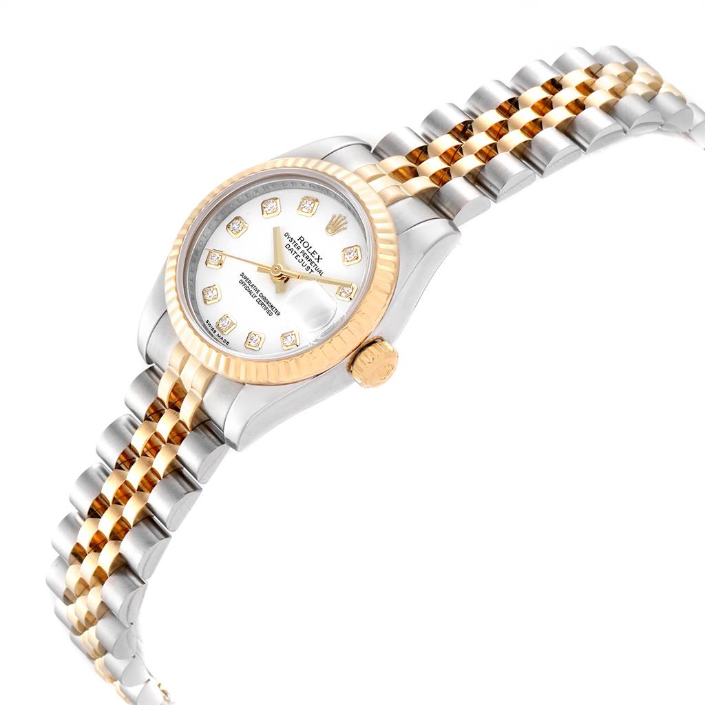 A Rolex Datejust 179173 Women's Steel and Gold (two tone) White Dial 179173 Women's Steel and Gold (two tone) White Dial watch shown from an angled side view, highlighting the face, bezel, crown, and bracelet.