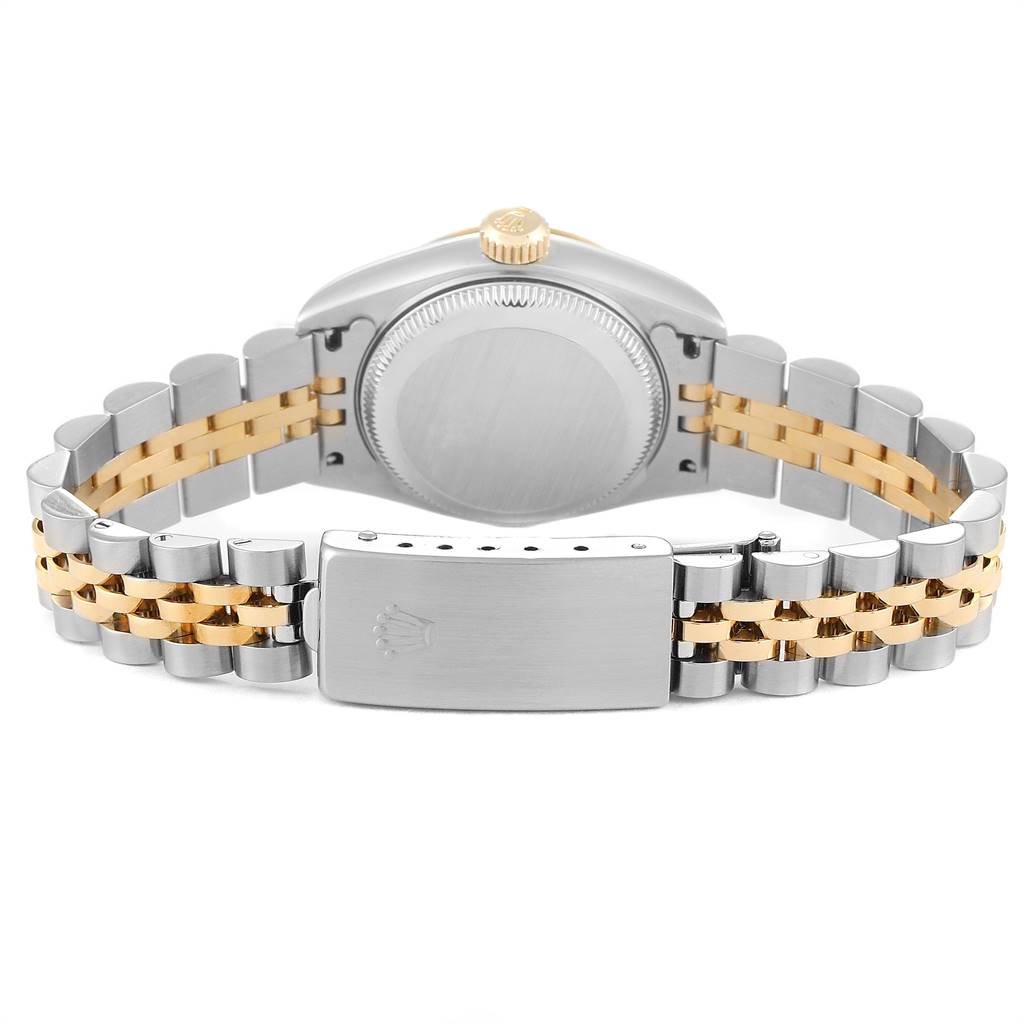 The image shows the back of the Rolex Datejust 69173 Women's Steel and Gold (two tone) Champagne Dial 69173 Women's Steel and Gold (two tone) Champagne Dial watch and its clasp, showcasing its two-tone bracelet and caseback.