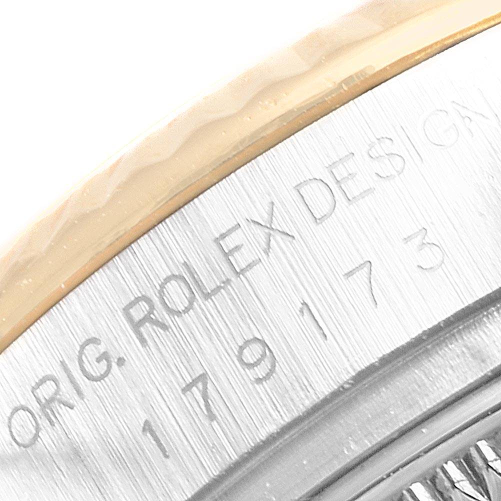 The image shows a close-up view of the engraved serial number on the side of a Rolex Datejust 179173 Women's Steel and Gold (two tone) White Dial 179173 Women's Steel and Gold (two tone) White Dial watch case.