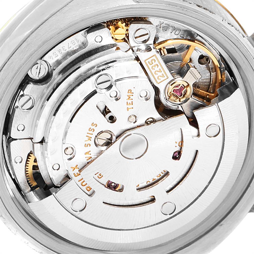 This is a close-up view of the movement mechanism of a Rolex Datejust 179173 Women's Steel and Gold (two tone) White Dial 179173 Women's Steel and Gold (two tone) White Dial watch.