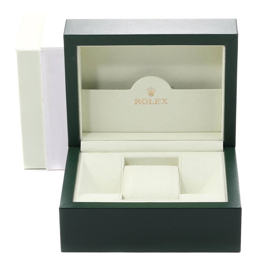 This image shows an open, green Rolex Datejust 179173 Women's Steel and Gold (two tone) White Dial 179173 Women's Steel and Gold (two tone) White Dial watch box, displaying its interior compartments and cushion.