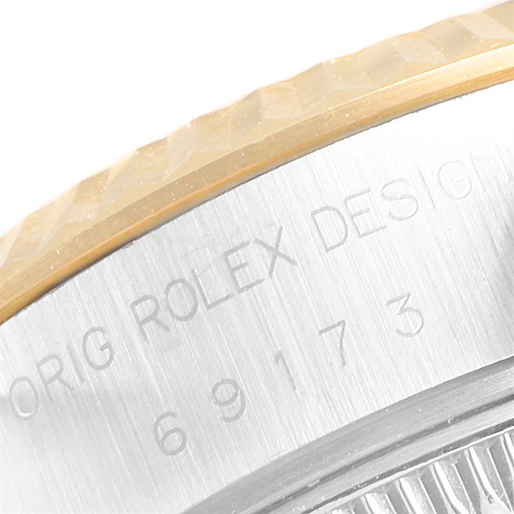 Close-up of a Rolex Datejust 69173 Women's Stainless Steel Champagne Dial 69173 Women's Stainless Steel Champagne Dial showing the model number and part of the bezel.