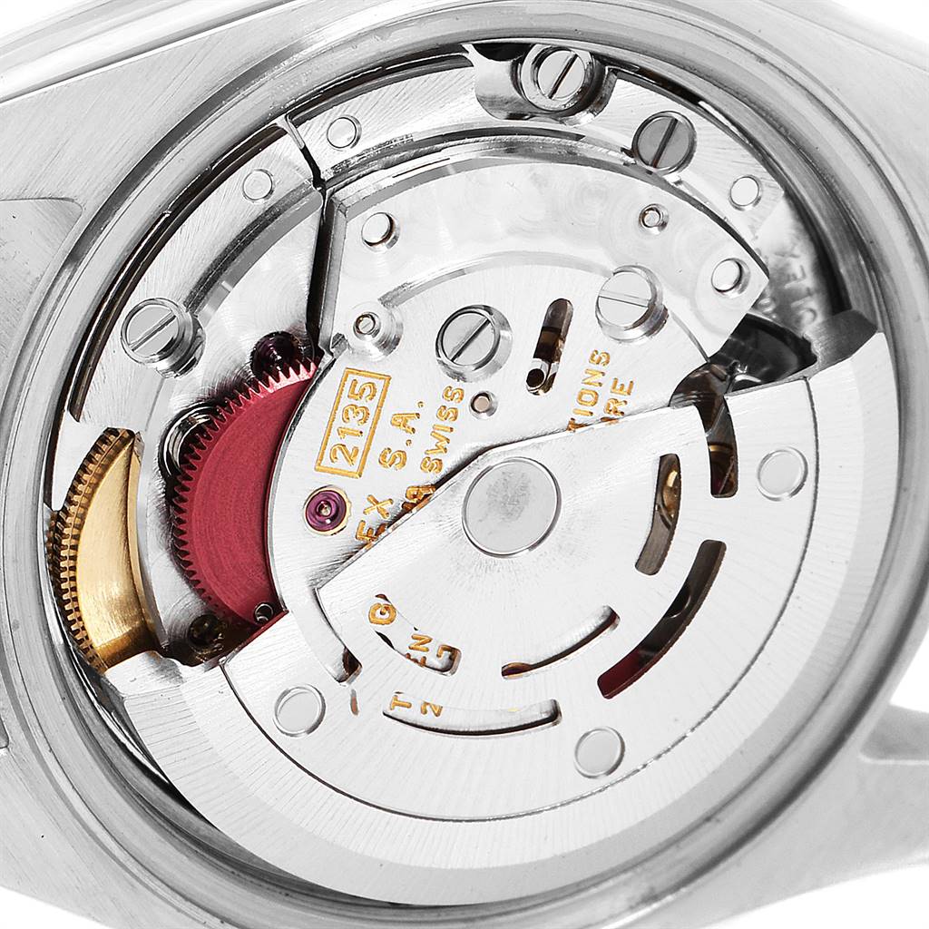 This image shows an internal view of the Rolex Datejust 69173 Women's Stainless Steel Champagne Dial 69173 Women's Stainless Steel Champagne Dial watch mechanism from a close-up angle.