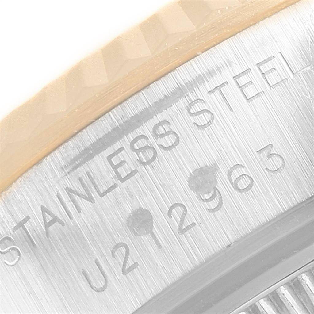 This image shows a close-up of the side of a Rolex Datejust 69173 Women's Stainless Steel Champagne Dial 69173 Women's Stainless Steel Champagne Dial watch, focusing on the serial number engraving on the stainless steel back.