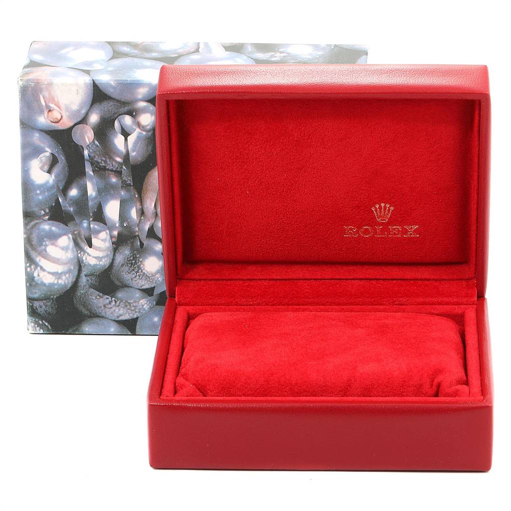 The image shows an open red Rolex watch box designed for the Datejust model, with a cushioned interior and the Rolex logo.