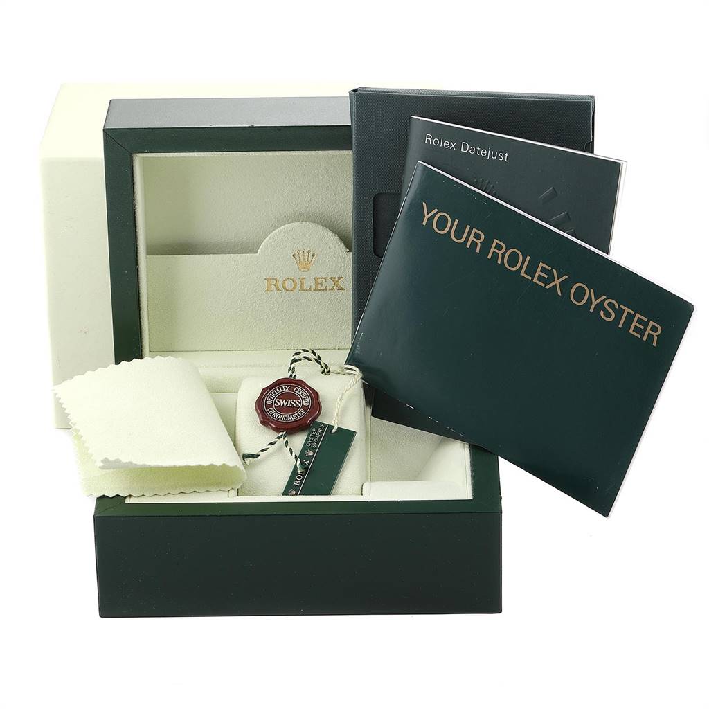 The image shows a Rolex Datejust 179174 Women
s Stainless Steel Silver Dial 179174 Women
s Stainless Steel Silver Dial packaging with booklets, a tag, and a cleaning cloth.