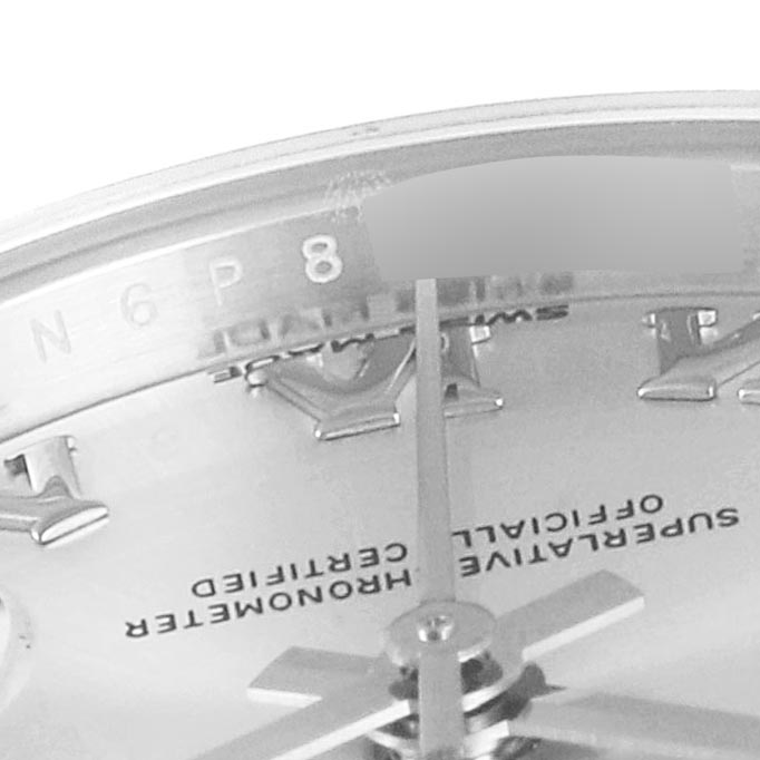 This close-up shot of the Rolex Datejust 279174 Women's Stainless Steel Grey Dial 279174 Women's Stainless Steel Grey Dial model shows a portion of the dial with Roman numerals, hands, and part of the rehaut.
