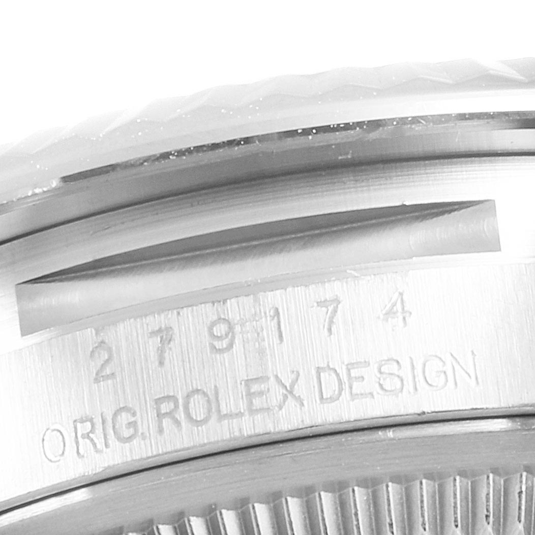 This close-up image shows a side view of the Rolex Datejust 279174 Women's Stainless Steel Grey Dial 279174 Women's Stainless Steel Grey Dial model, highlighting its bezel and engraved design details.