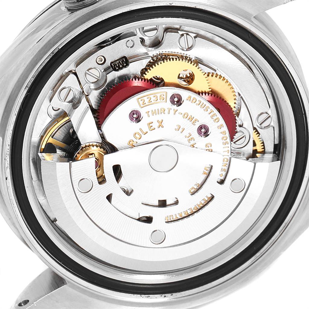 The image shows a close-up view of the movement mechanism of a Rolex Datejust 279174 Women's Stainless Steel Grey Dial 279174 Women's Stainless Steel Grey Dial watch, highlighting gears and internal components.