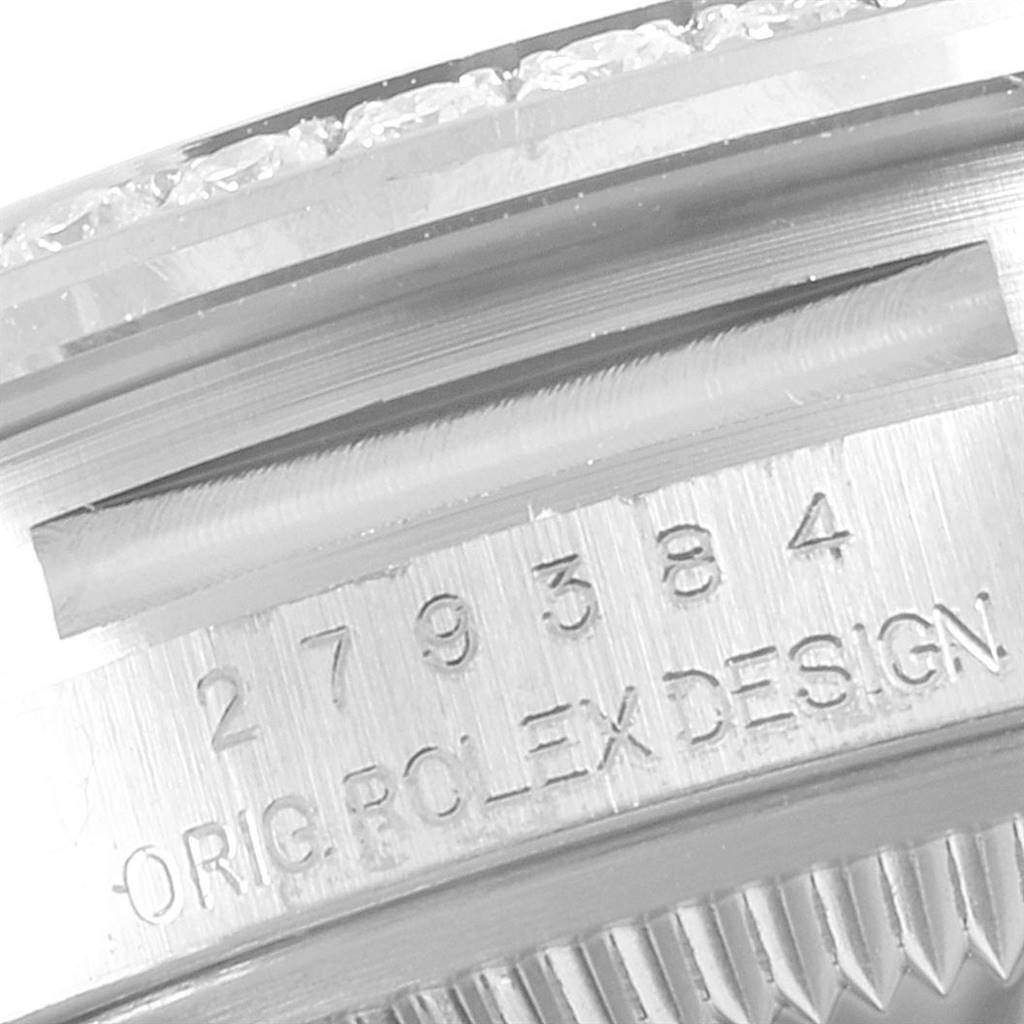 This image shows a close-up of the engraved serial number and "ORIG. ROLEX DESIGN" on the case of a Rolex Datejust 279384 Women
s Stainless Steel Mother of Pearl Dial 279384 Women
s Stainless Steel Mother of Pearl Dial watch.