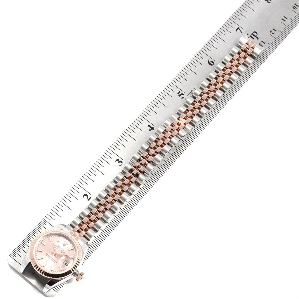 This Rolex Datejust 179171 Women's Steel and Gold (two tone) Pink Dial 179171 Women's Steel and Gold (two tone) Pink Dial watch is shown from a top-down angle with a ruler measuring its bracelet length.