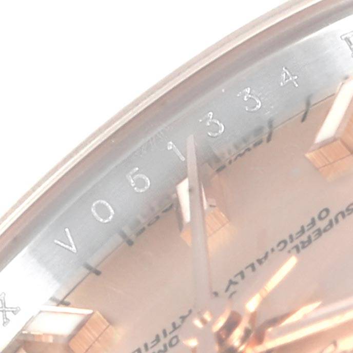The image shows a close-up angle of the face and partially visible serial number of a Rolex Datejust 179171 Women's Steel and Gold (two tone) Pink Dial 179171 Women's Steel and Gold (two tone) Pink Dial watch.