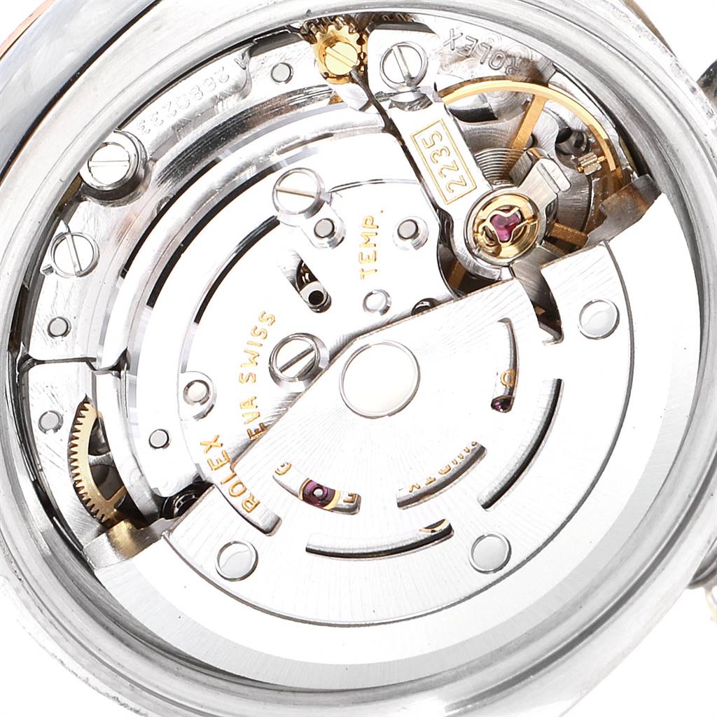 The image shows the inner mechanical movement of a Rolex Datejust 179171 Women's Steel and Gold (two tone) Pink Dial 179171 Women's Steel and Gold (two tone) Pink Dial watch, highlighting the intricate gears and components.