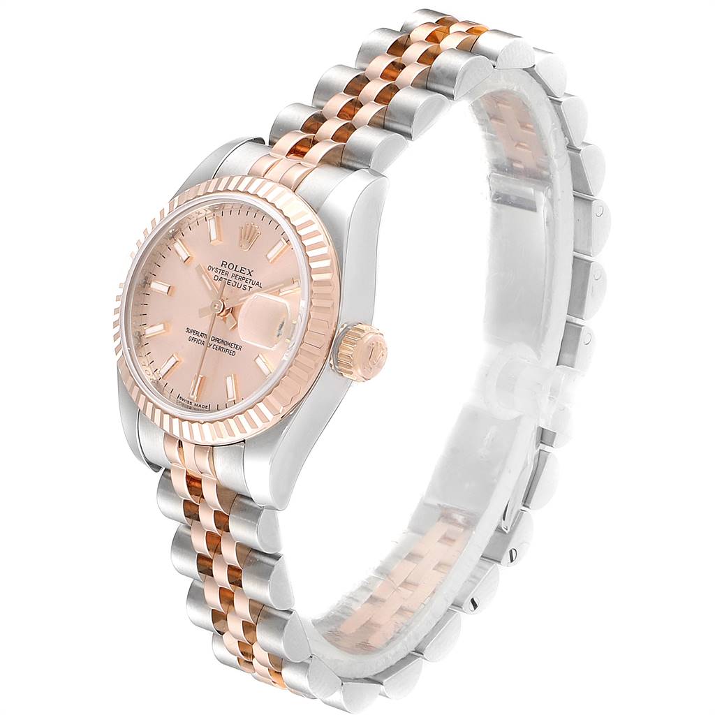The Rolex Datejust 179171 Women's Steel and Gold (two tone) Pink Dial 179171 Women's Steel and Gold (two tone) Pink Dial watch is shown at an angled side view, highlighting its pink dial, fluted bezel, and two-tone bracelet.