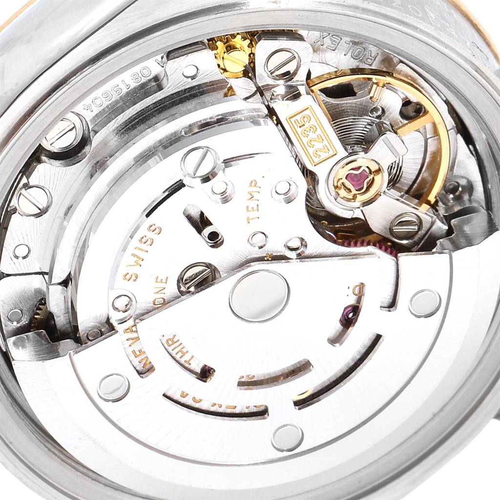 This image shows the movement's intricate inner workings of a Rolex Datejust 79173 Women's Steel and Gold (two tone) Mother of Pearl Dial 79173 Women's Steel and Gold (two tone) Mother of Pearl Dial watch.