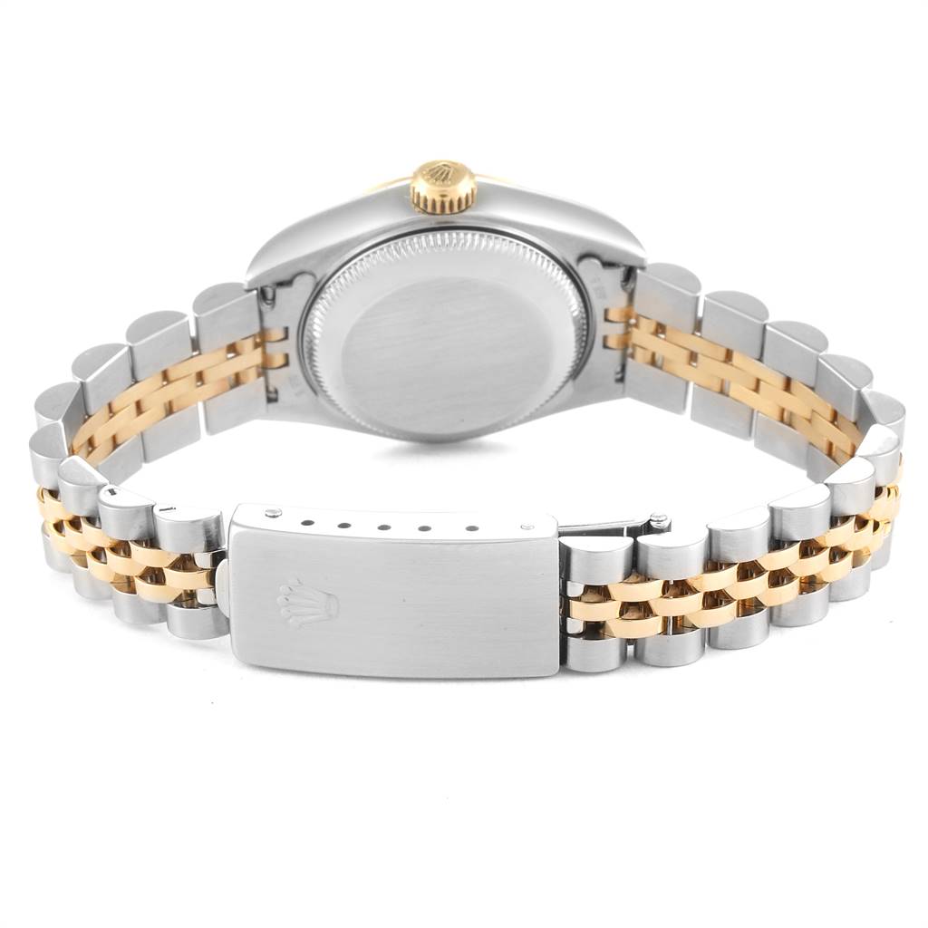The image shows the back view of the case, crown, and bracelet clasp of a Rolex Datejust 79173 Women's Steel and Gold (two tone) Mother of Pearl Dial 79173 Women's Steel and Gold (two tone) Mother of Pearl Dial watch.