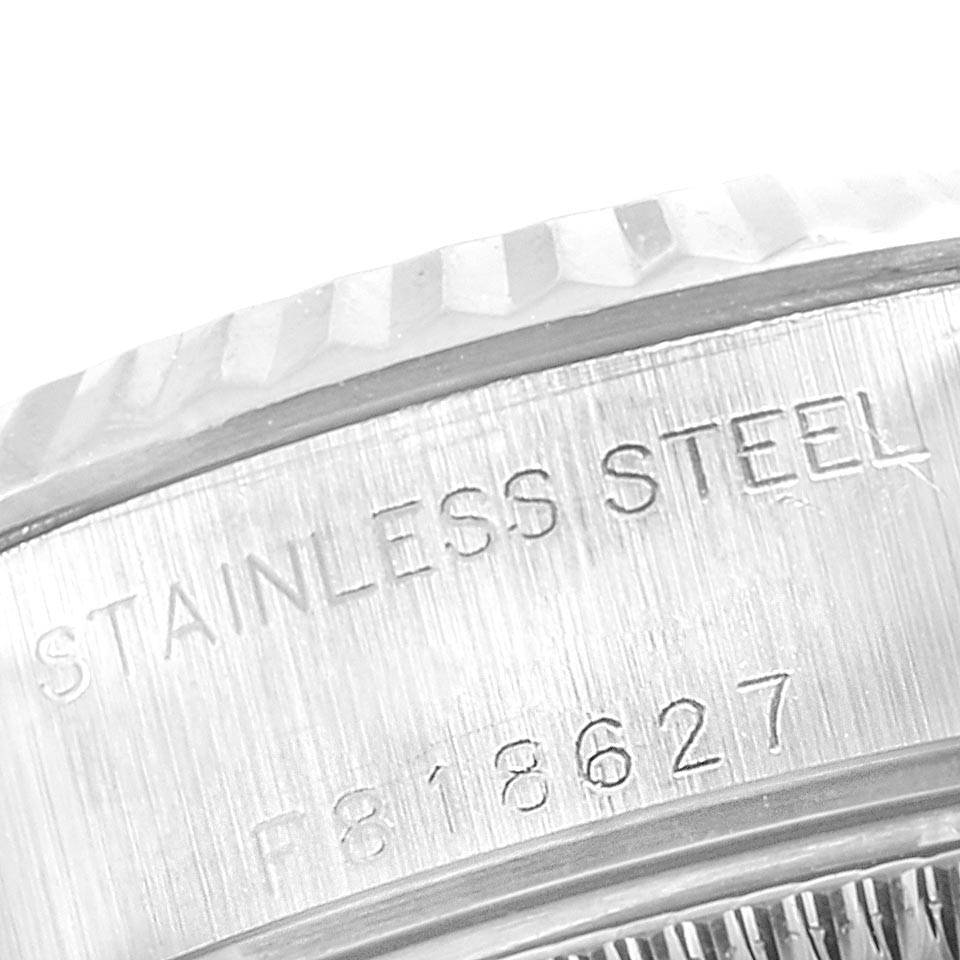 The image shows a close-up of the stainless steel bezel and engravings on the side of a Rolex Datejust 79174 Women
s Stainless Steel Silver Dial 79174 Women
s Stainless Steel Silver Dial watch.