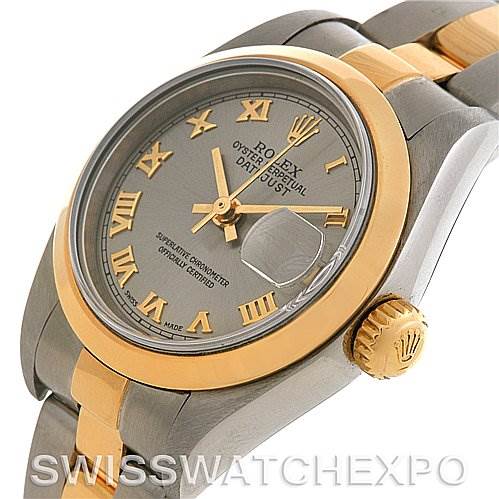 This image showcases a Rolex Datejust 79163 Women's Steel and Gold (two tone) Silver Dial 79163 Women's Steel and Gold (two tone) Silver Dial watch at an angle focusing on the dial, bezel, crown, and a portion of the bracelet.