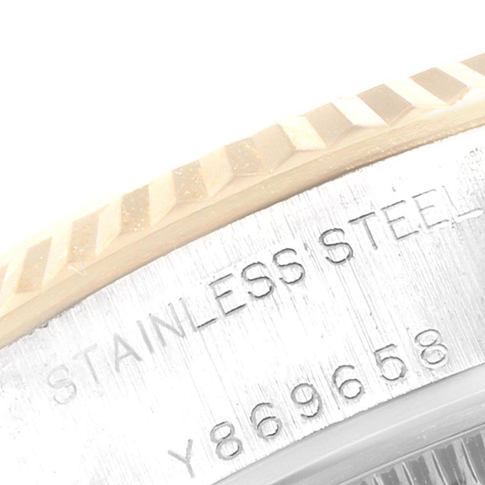 The image displays a close-up of the stainless steel bezel with fluted edges of a Rolex Datejust 79173 Women's Stainless Steel Grey Dial 79173 Women's Stainless Steel Grey Dial watch.