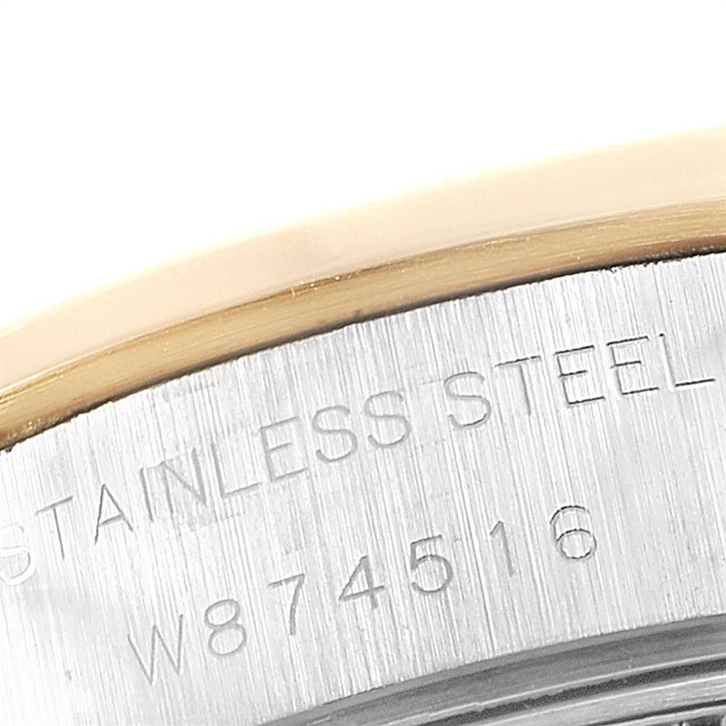 The image shows a close-up of the case back edge with "STAINLESS STEEL" and serial number on a Rolex Datejust 69163 Women's Steel and Gold (two tone) Grey Dial 69163 Women's Steel and Gold (two tone) Grey Dial.