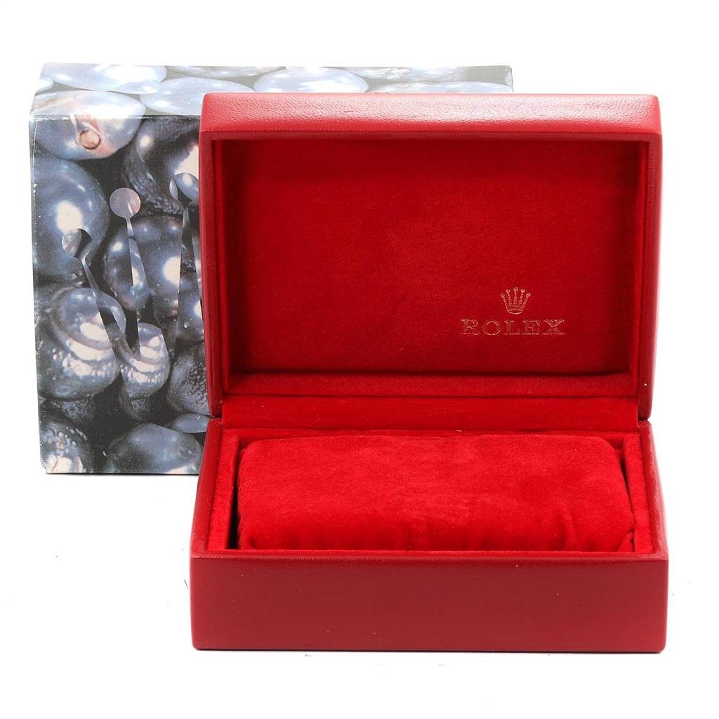 The image shows a red Rolex watch box for the Datejust model with the lid open, revealing its cushioned interior.