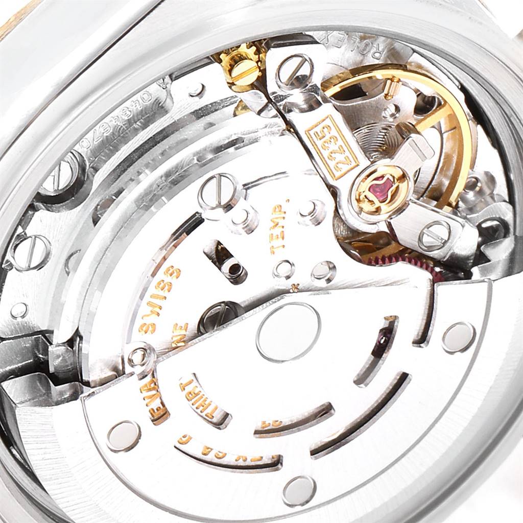 This image shows a close-up view of the movement mechanism inside a Rolex Datejust 79173 Women's Steel and Gold (two tone) Black Dial 79173 Women's Steel and Gold (two tone) Black Dial watch.