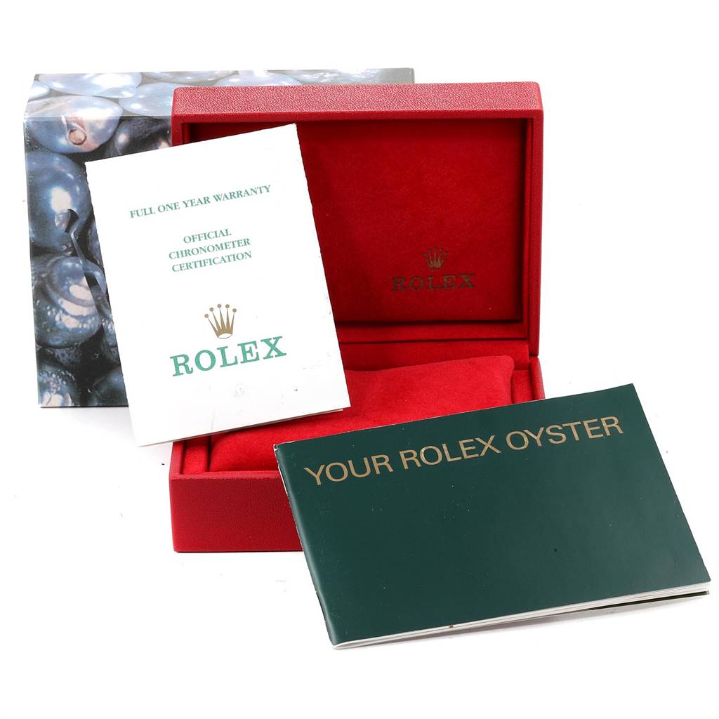This image shows the box, warranty booklet, and manual for a Rolex Datejust 79173 Women's Steel and Gold (two tone) Black Dial 79173 Women's Steel and Gold (two tone) Black Dial model watch.