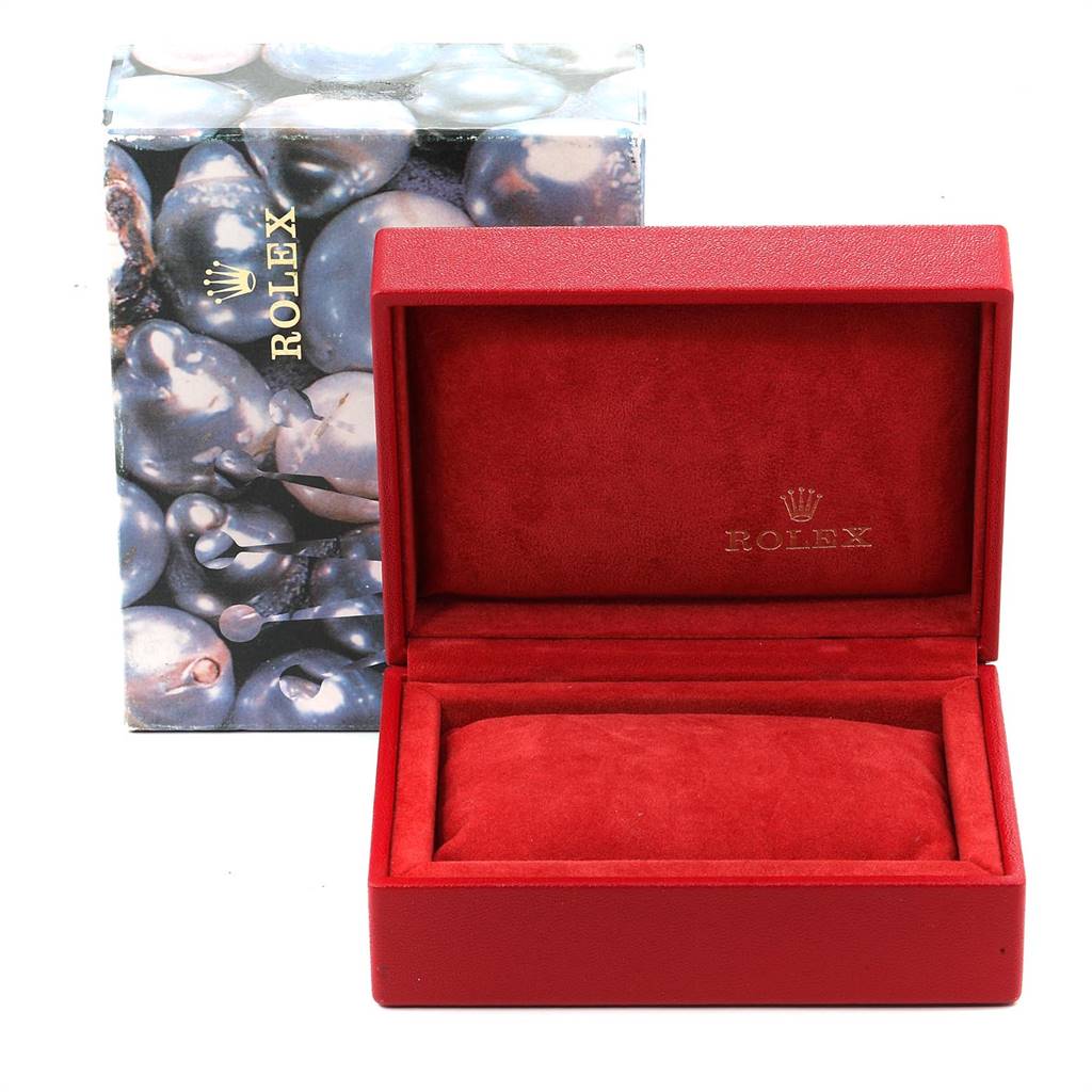 The image shows a Rolex Datejust 79174 Women
s Stainless Steel Silver Dial 79174 Women
s Stainless Steel Silver Dial watch box and cushion at an eye-level angle, with the box open and the outer packaging visible behind it.