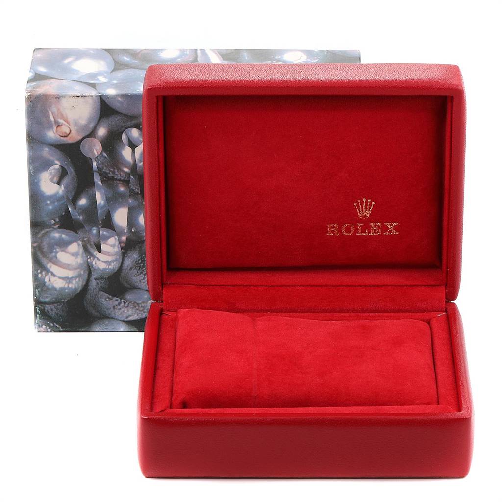 The image shows a red Rolex Datejust 69173 Women's Stainless Steel Blue Dial 69173 Women's Stainless Steel Blue Dial watch box, open, revealing the interior cushion, with a Rolex logo inside the lid.