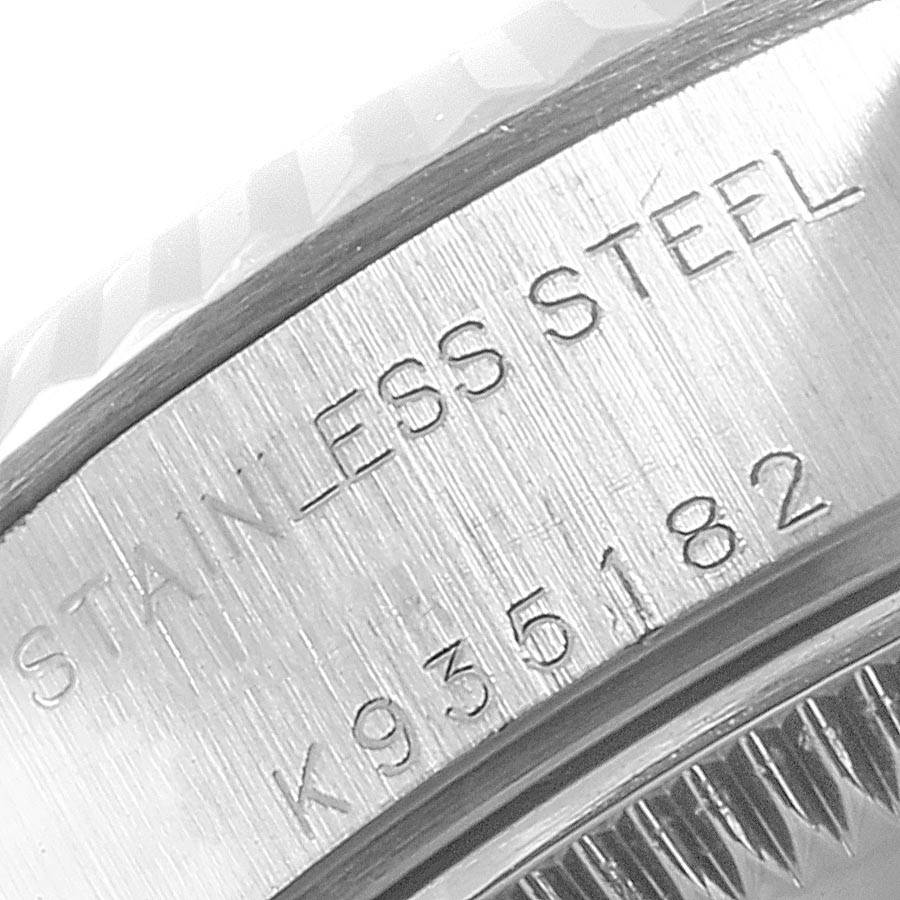 The image shows a close-up angle of the side of the case of the Rolex Datejust 79174 Women
s Stainless Steel Pink Dial 79174 Women
s Stainless Steel Pink Dial, featuring the model number and "stainless steel" engraving.