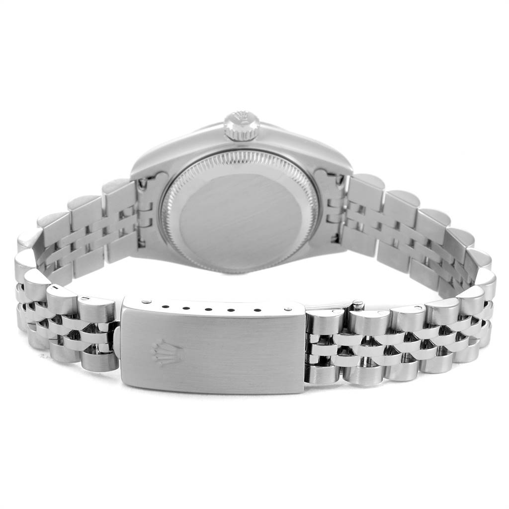 This image shows the back of a Rolex Datejust 79174 Women
s Stainless Steel Pink Dial 79174 Women
s Stainless Steel Pink Dial watch and its Jubilee bracelet from a rear angle.