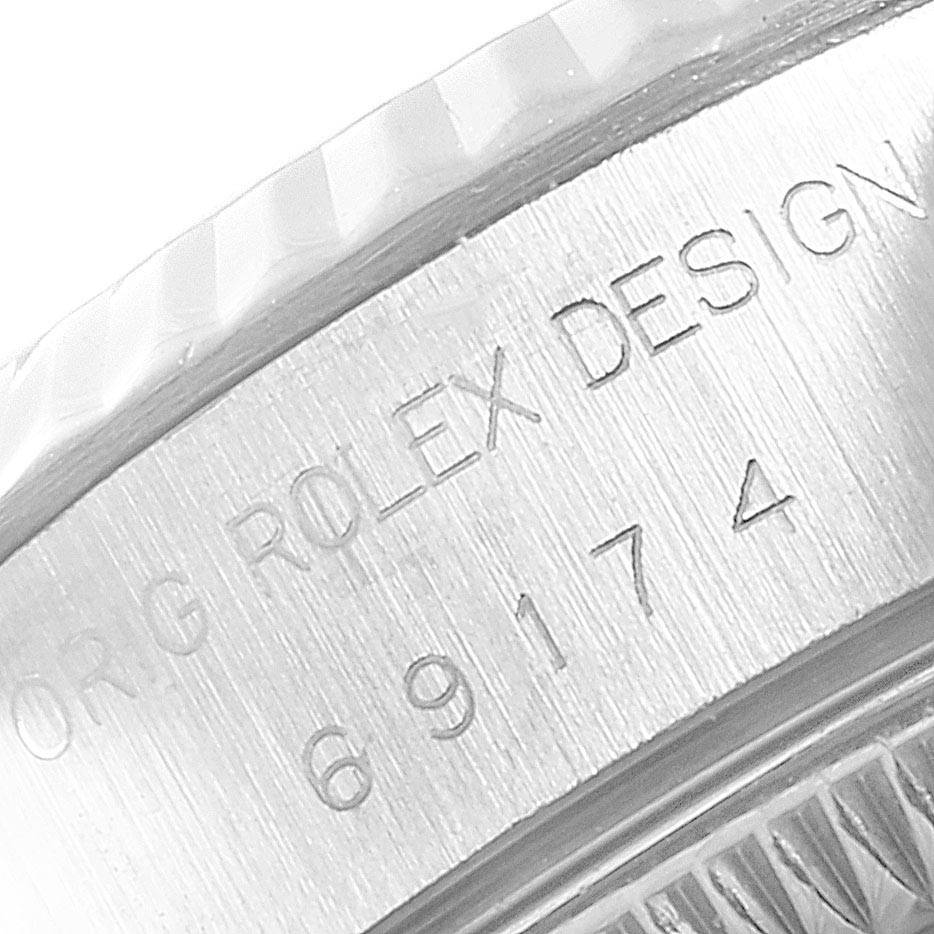 This image shows a close-up of the side engraving on a Rolex Datejust 69174 Women
s Stainless Steel Silver Dial 69174 Women
s Stainless Steel Silver Dial watch case.