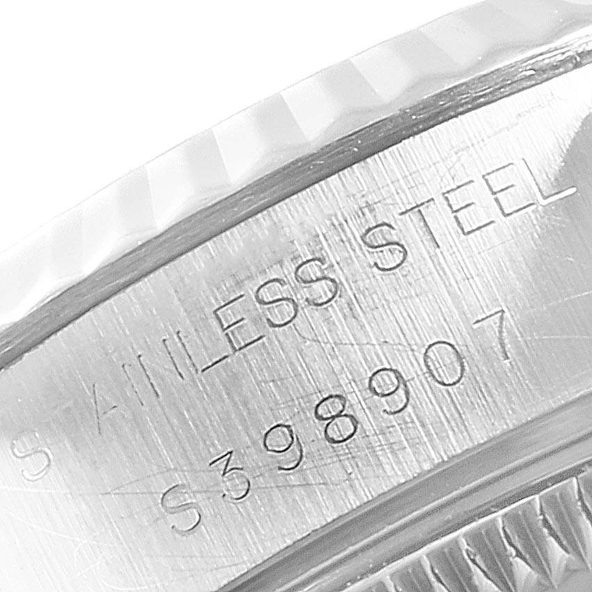 This close-up image shows the stainless steel caseback and inscriptions on a Rolex Datejust 69174 Women
s Stainless Steel Silver Dial 69174 Women
s Stainless Steel Silver Dial watch.