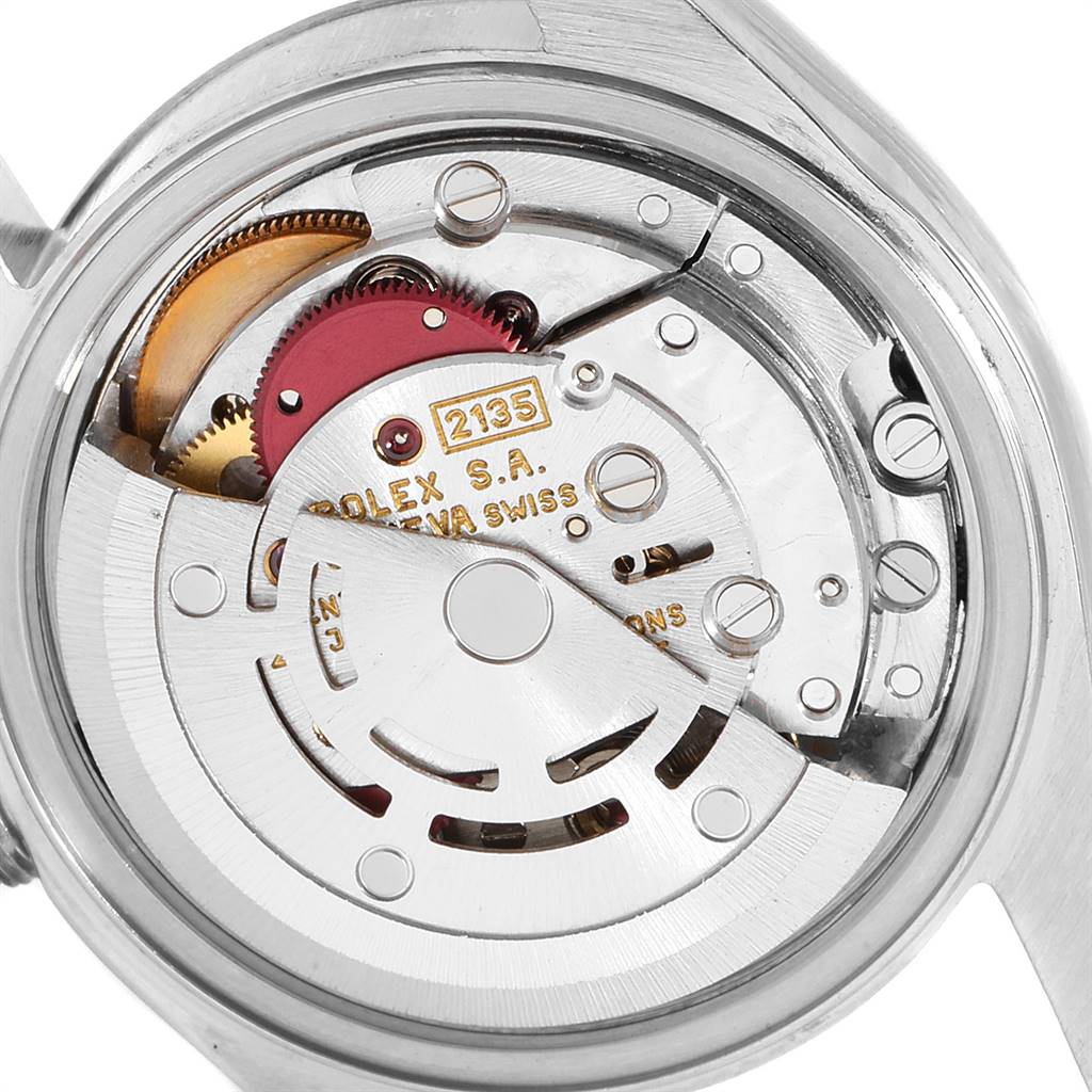 The image shows a close-up of the movement mechanism of a Rolex Datejust 69174 Women
s Stainless Steel Silver Dial 69174 Women
s Stainless Steel Silver Dial watch.