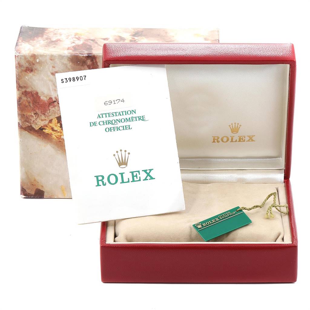 The image shows an open Rolex Datejust 69174 Women
s Stainless Steel Silver Dial 69174 Women
s Stainless Steel Silver Dial watch box, a certificate, and a hang tag, viewed from the front.