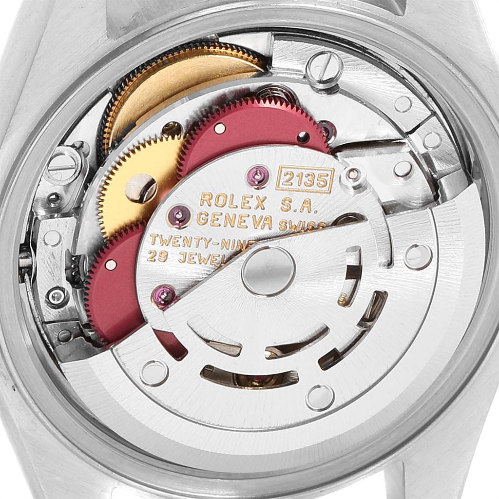 This image shows a close-up view of the movement inside a Rolex Datejust 69173 Women's Stainless Steel White Dial 69173 Women's Stainless Steel White Dial watch, highlighting the gears and internal mechanics.
