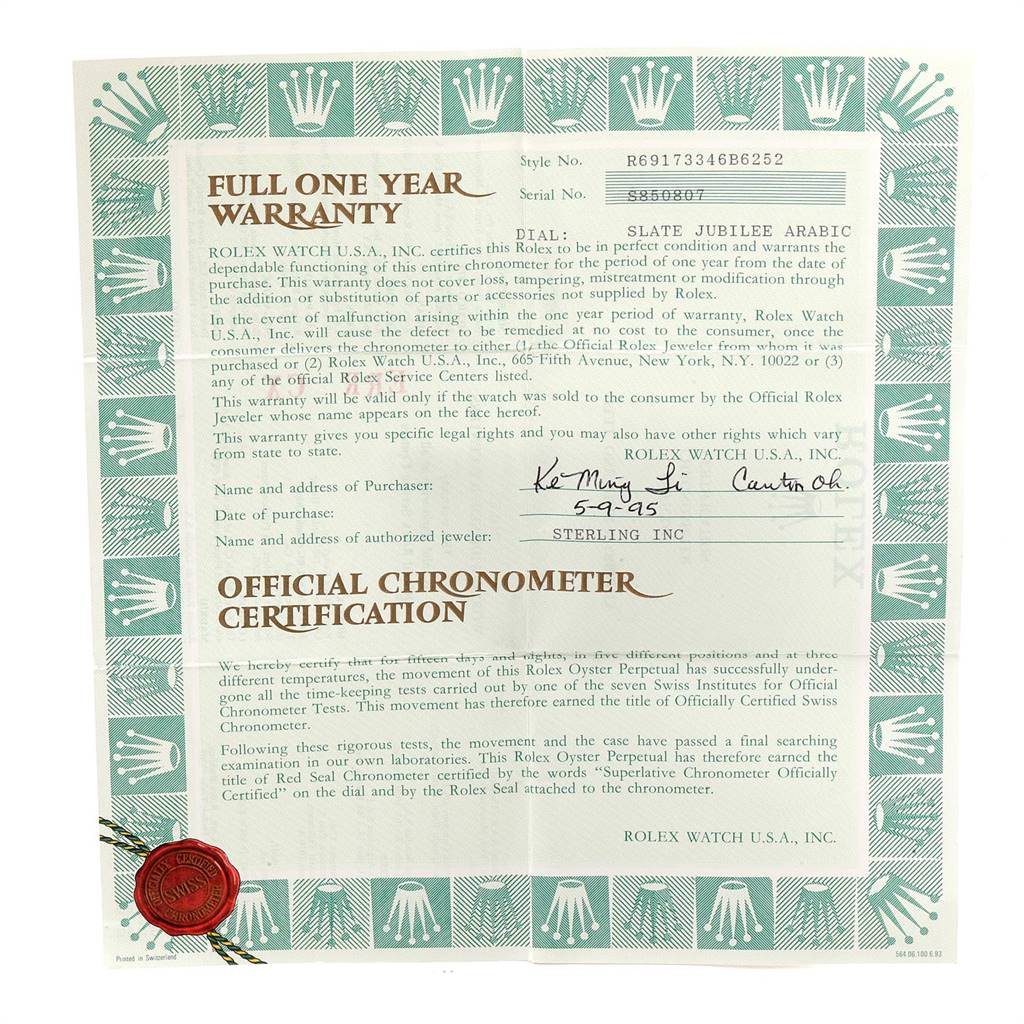 The image shows a full one-year warranty card and official chronometer certification for a Rolex Datejust 69173 Women's Stainless Steel Black Dial 69173 Women's Stainless Steel Black Dial model.