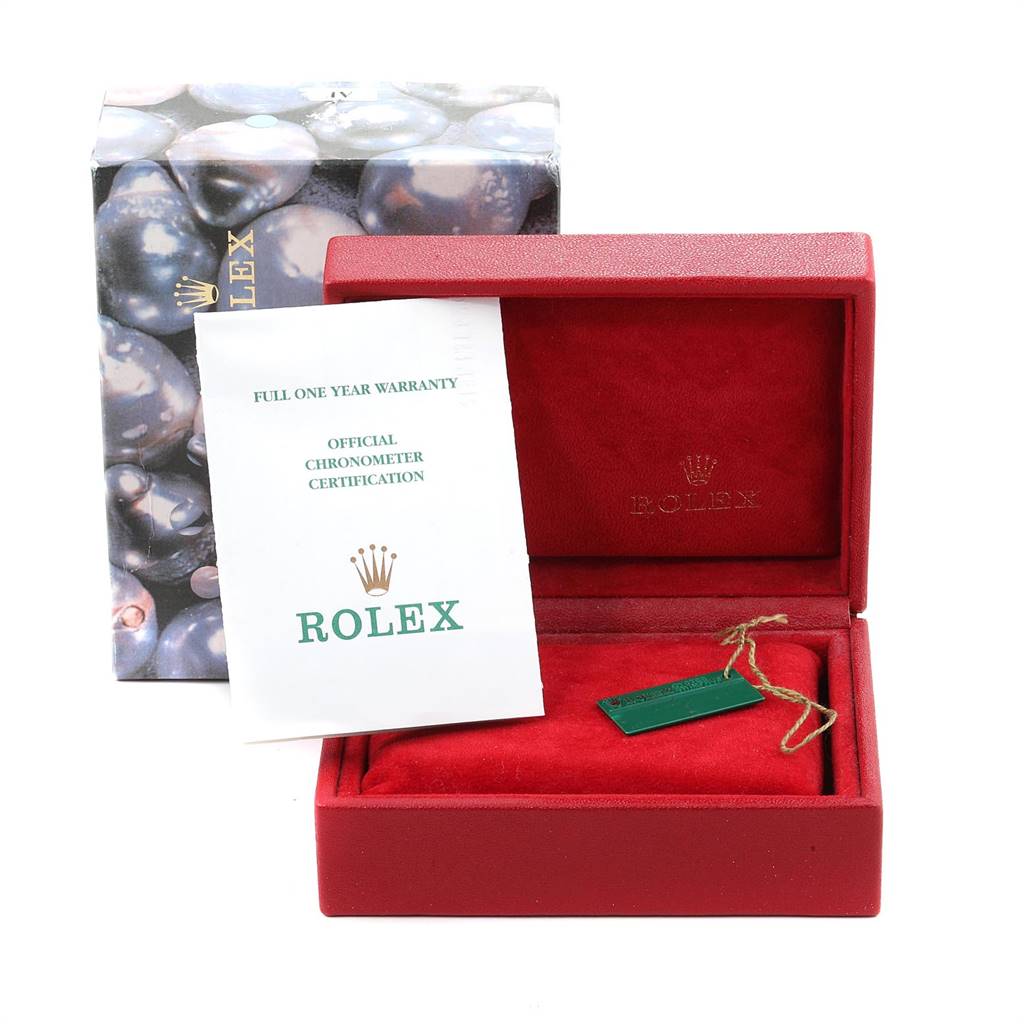 The image shows a warranty and certification papers, tag, and box for the Rolex Datejust 79163 Women's Steel and Gold (two tone) Grey Dial 79163 Women's Steel and Gold (two tone) Grey Dial watch, from a front angle.