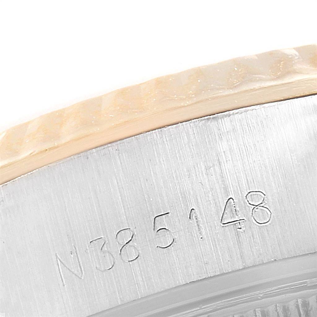This image shows a close-up of the side case and engraved serial number on a Rolex Datejust 69173 Women's Stainless Steel Champagne Dial 69173 Women's Stainless Steel Champagne Dial model watch.