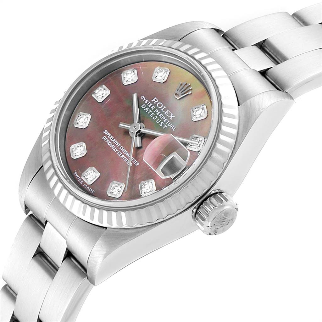 The image shows a close-up of the Rolex Datejust 79174 Women's Stainless Steel Mother of Pearl Dial 79174 Women's Stainless Steel Mother of Pearl Dial watch from a side angle, highlighting the dial, bezel, watch crown, and part of the bracelet.