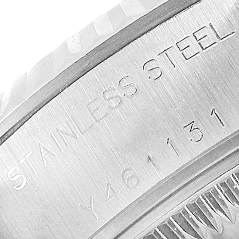 This close-up image shows the stainless steel engravings on the case side of a Rolex Datejust 79174 Women's Stainless Steel Mother of Pearl Dial 79174 Women's Stainless Steel Mother of Pearl Dial watch.