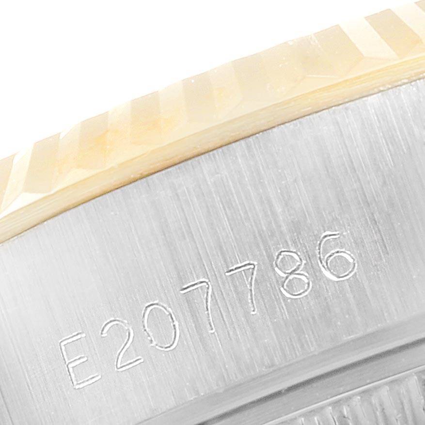 This close-up image shows the serial number engraved on the side of the case of a Rolex Datejust 69173 Women's Stainless Steel Champagne Dial 69173 Women's Stainless Steel Champagne Dial watch.