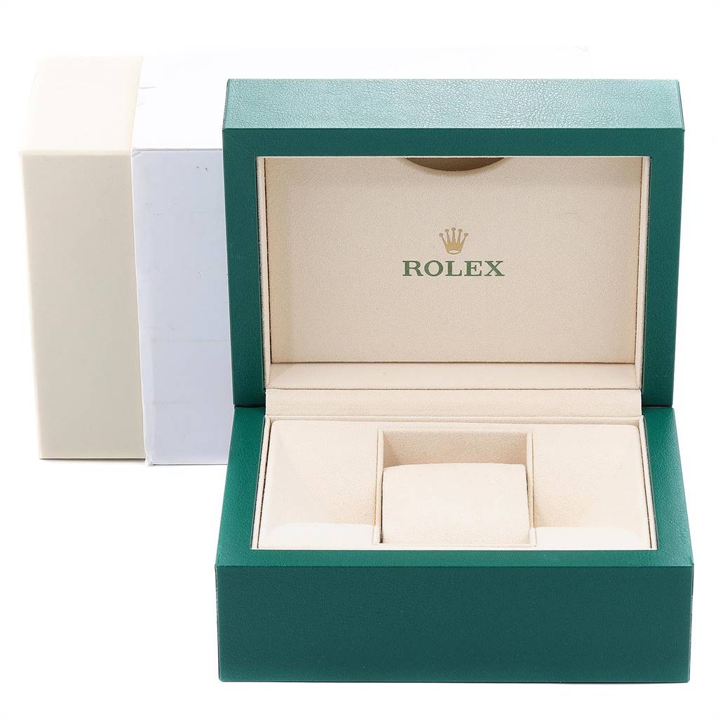 This image shows an open Rolex Datejust 179384 Women's Stainless Steel White Dial 179384 Women's Stainless Steel White Dial watch box in green, with an inner beige cushion and compartment.