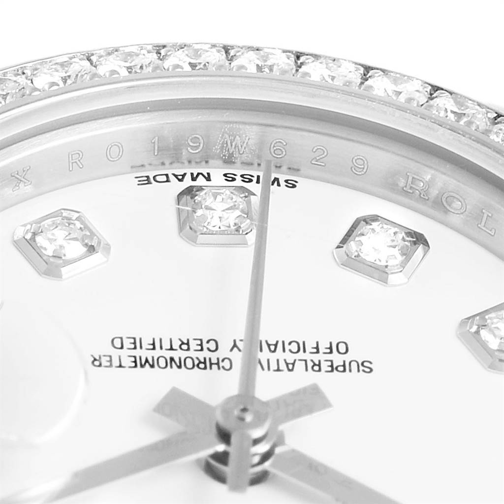 This close-up image of a Rolex Datejust 179384 Women's Stainless Steel White Dial 179384 Women's Stainless Steel White Dial watch shows the diamond-studded dial and the "Swiss Made" inscription.
