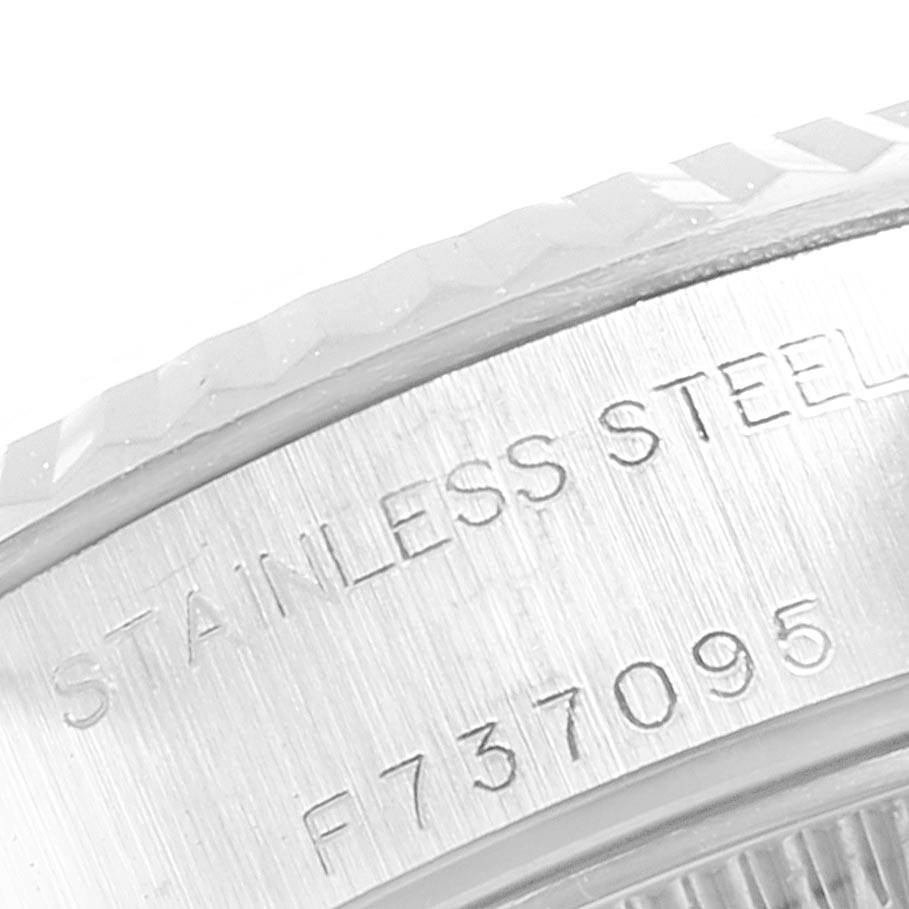This close-up image shows the side engraving on the stainless steel case of a Rolex Datejust 79174 Women
s Stainless Steel Mother of Pearl Dial 79174 Women
s Stainless Steel Mother of Pearl Dial.