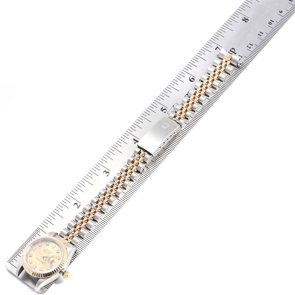 The image shows a Rolex Datejust 69173 Women's Stainless Steel Champagne Dial 69173 Women's Stainless Steel Champagne Dial watch laying flat, with the full band and face visible, next to a ruler for measurement.